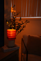 Futuristic glowing red light bulb on a dark background